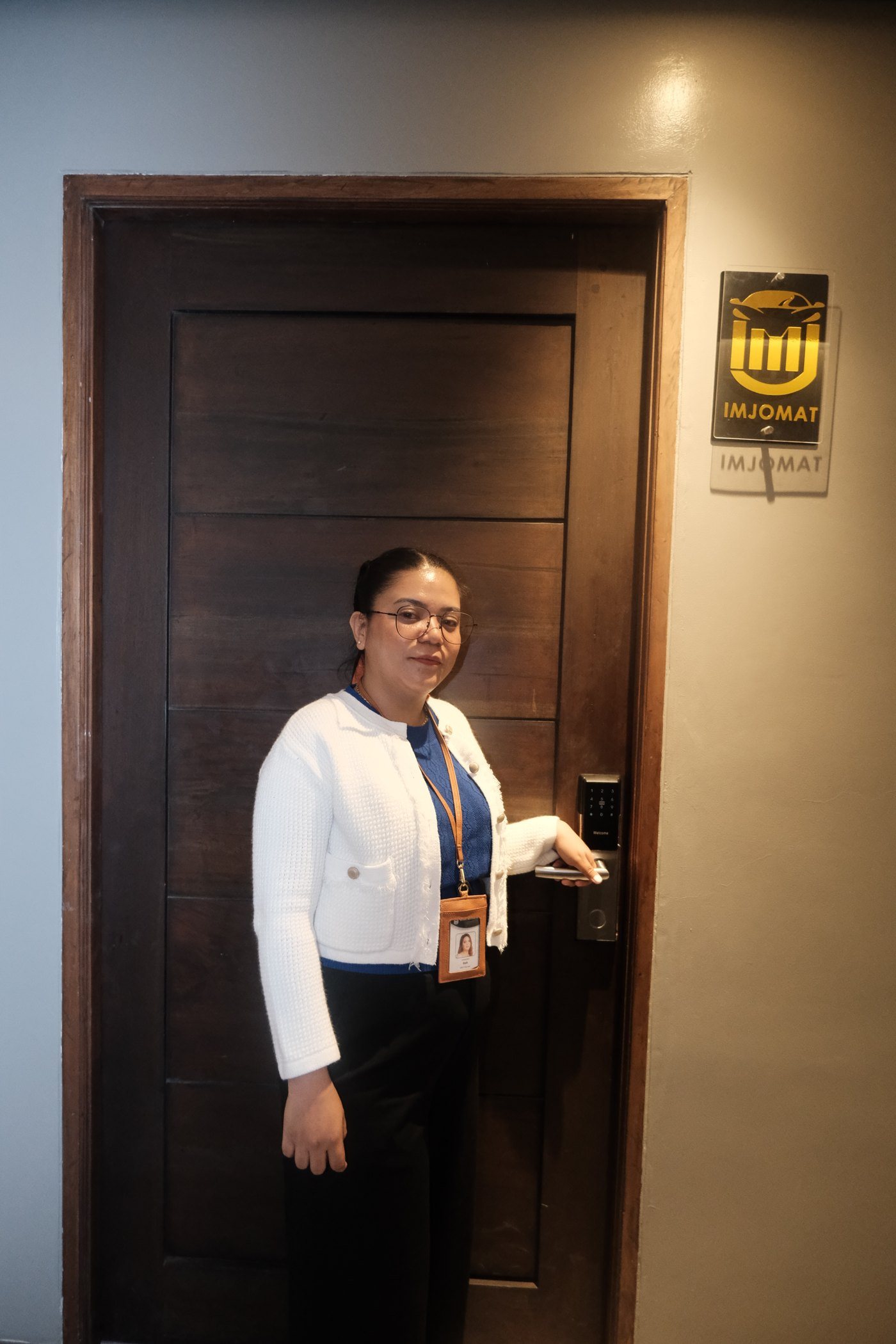 Sarah Garcia, founder of Imjomat, clocking in at the office door on the in-house device she built with Foundreco